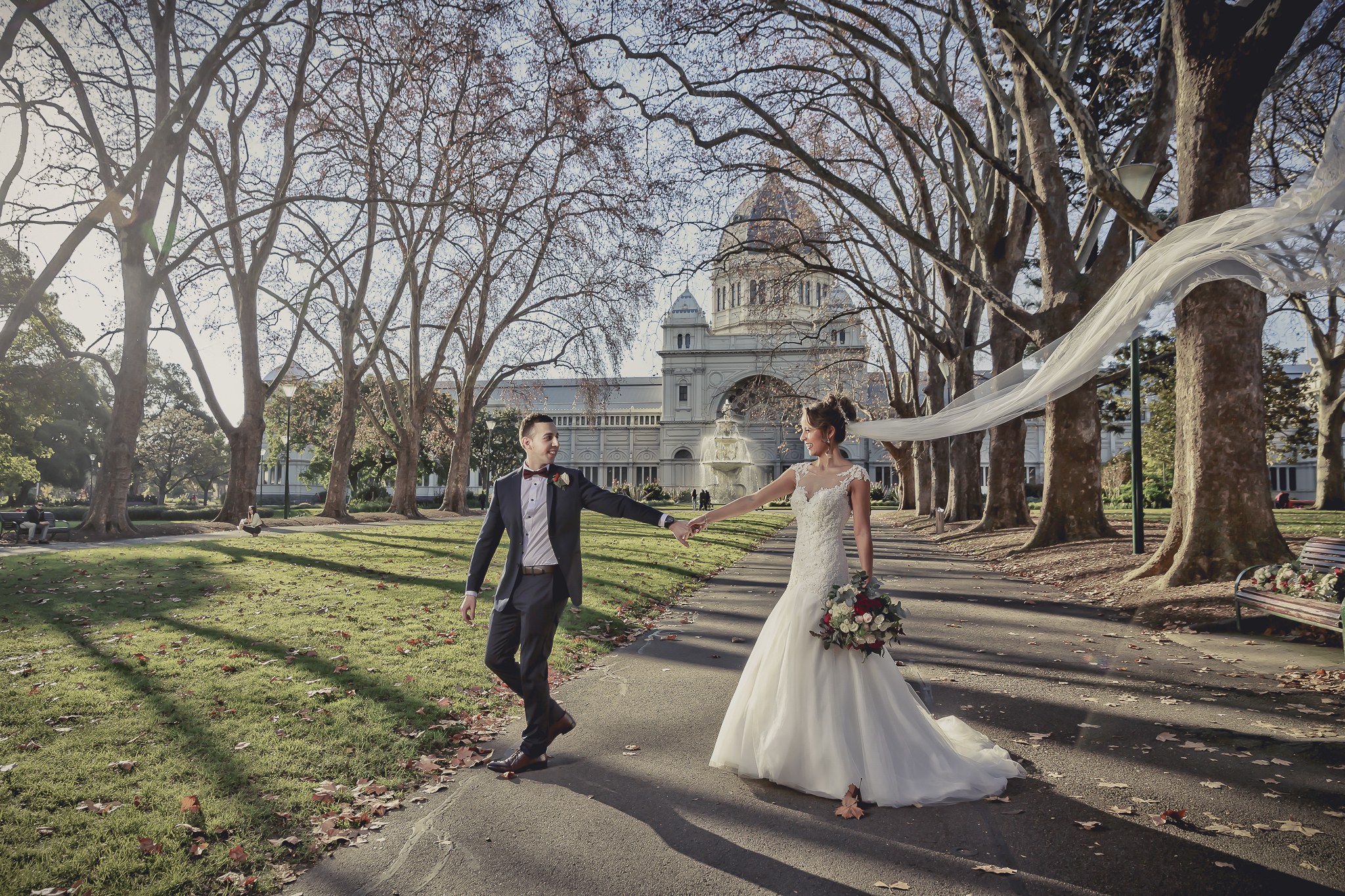 A romantic, candid shot of a bride and groom sharing an intimate, joyful moment during a professional wedding photoshoot in a scenic garden setting. A romantic, candid shot of a bride and groom sharing an intimate, joyful moment during a professional wedding photoshoot in a scenic garden setting.