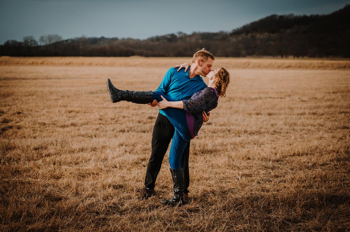 Engagement photo in an open field in Kansas City, MO